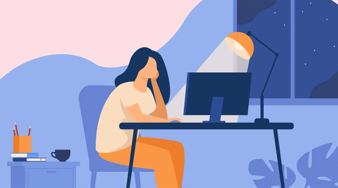 Piirroshahmo tietokoneen ääressä lampun valossa.