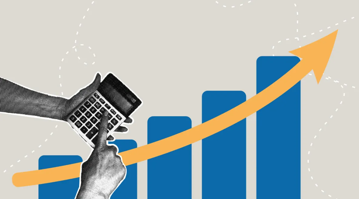 Käsiparit joissa laskin. Taustalla graafisia palkkeja.