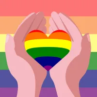 Alt-teksti: Kuvituskuva, jossa kaksi kättä pitelee sydämen muotoista esinettä sateenkaarilippua vasten. Sydän ja tausta ovat sateenkaaren väreissä, symboloiden LGBTQ+ -yhteisön tukemista ja yhdenvertaisuutta.