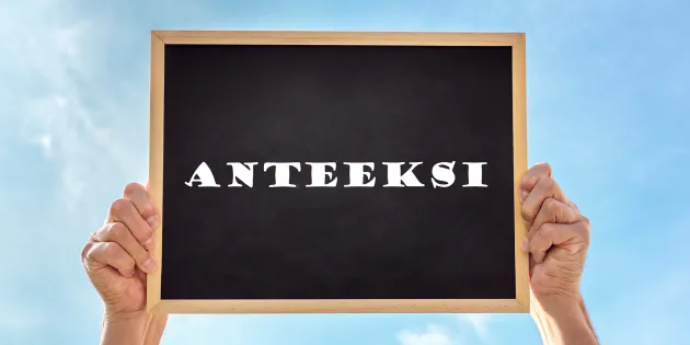 Taulu, johon on kirjoitettu sana &quot;anteeksi&quot;. 